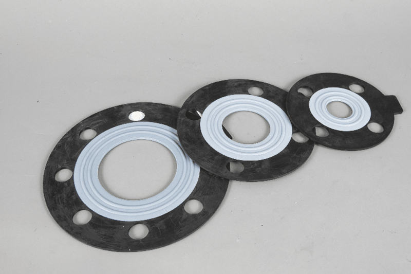 Non-metallic gasket for tightening between the connecting electronics and the nut